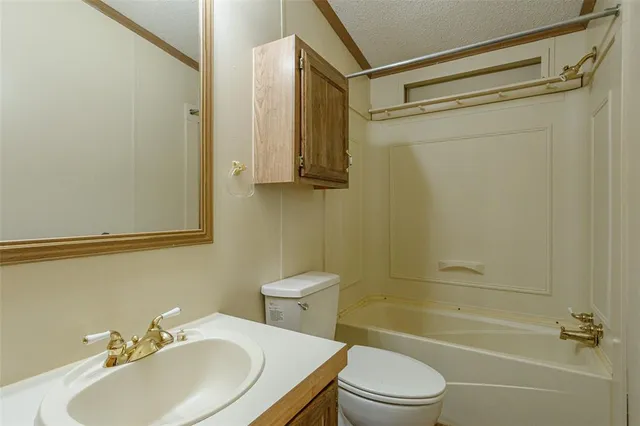 a view of a room with window and ceiling fan