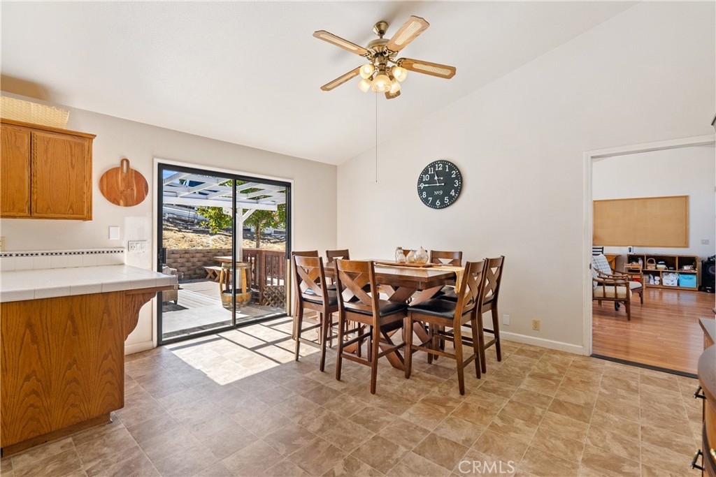 3880 Ardilla Road Atascadero, CA 93422 - Photo 17 of 60 a view of a dining room with furniture and a chandelier