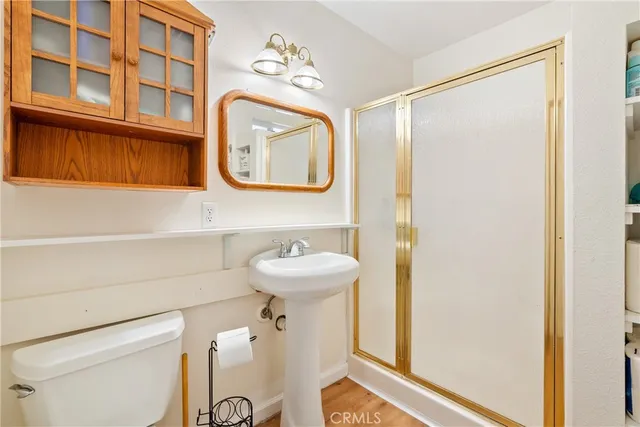 a bedroom with a bed and a chair