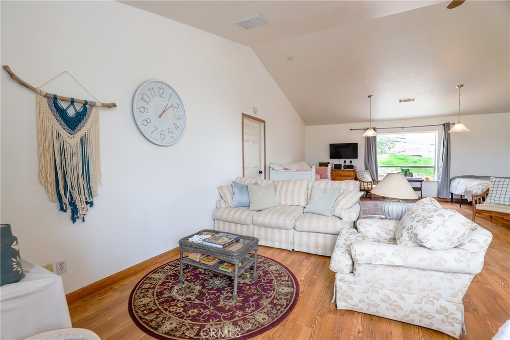 3880 Ardilla Road Atascadero, CA 93422 - Photo 22 of 66 This corner of the room could operate as the living room. It easily accommodates a full couch and comfortable chair.