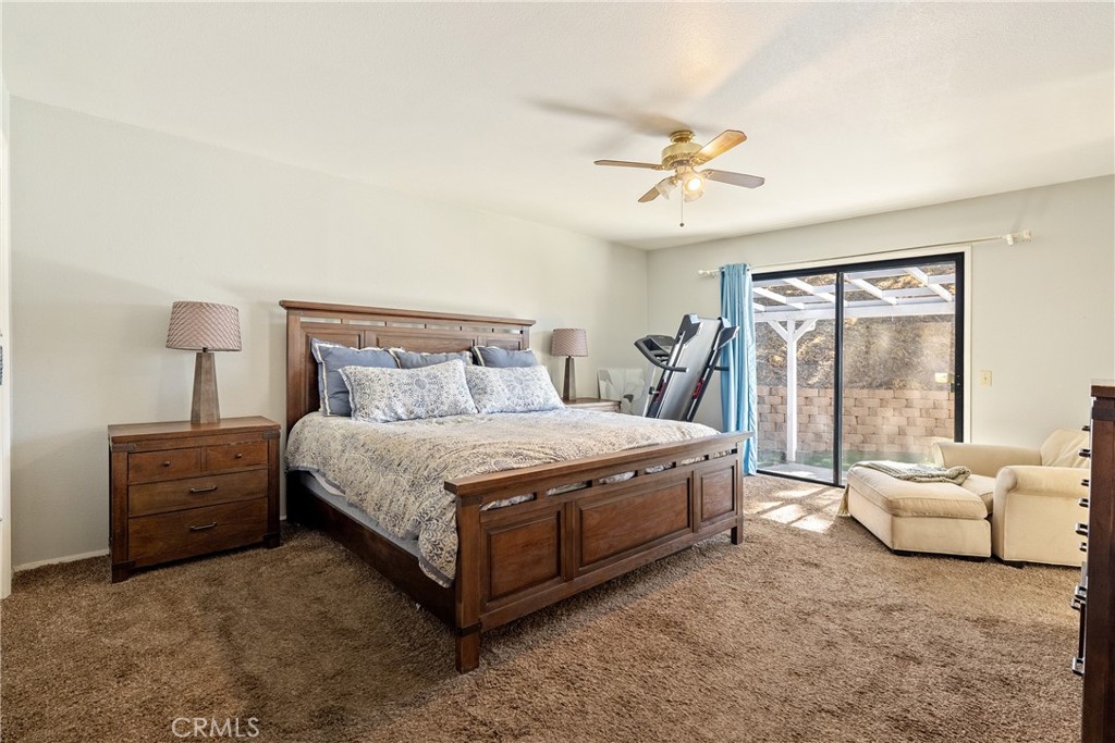 3880 Ardilla Road Atascadero, CA 93422 - Photo 26 of 60 a bed room with a bed and a couch