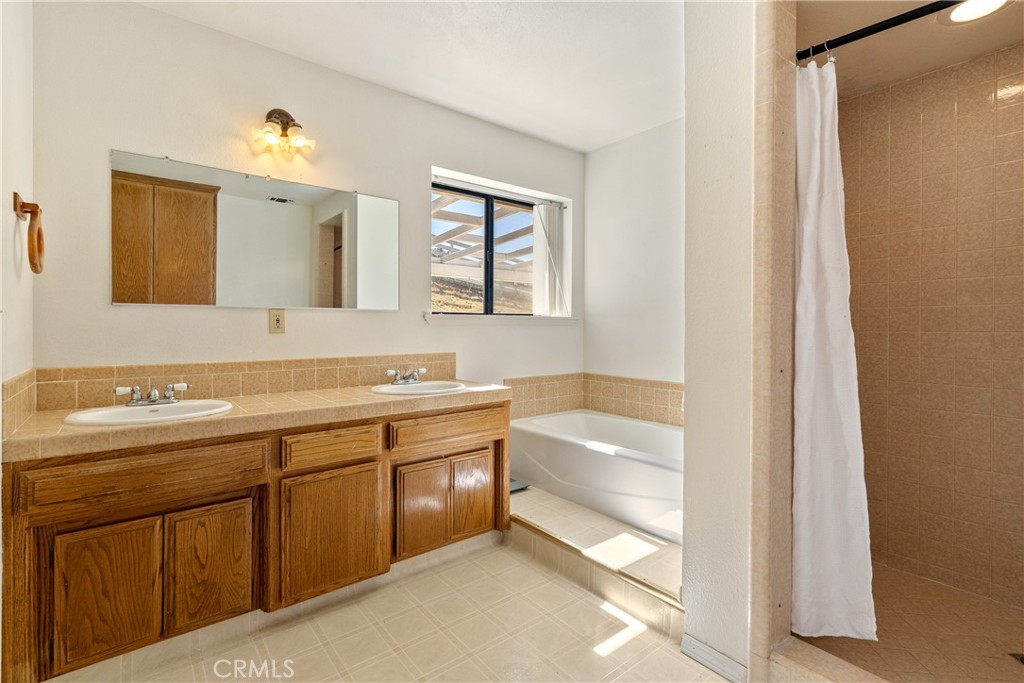 3880 Ardilla Road Atascadero, CA 93422 - Photo 35 of 66 The bathroom has a generously sized double sink vanity so each occupant can have their own space.
