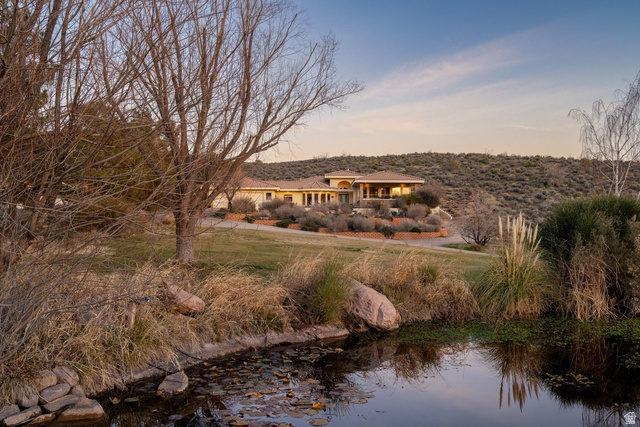 779 South Silver Road Leeds, UT 84746 - Photo 75 of 80 Back of property at dusk with a yard and a water view