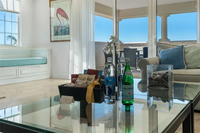 a dining room with furniture and the view of kitchen