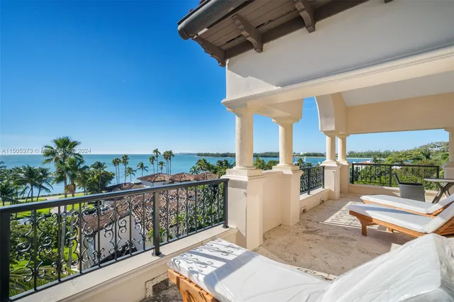 a view of a patio with a table and chairs