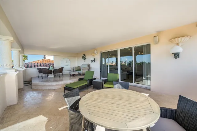 a living room with couches a table and chairs