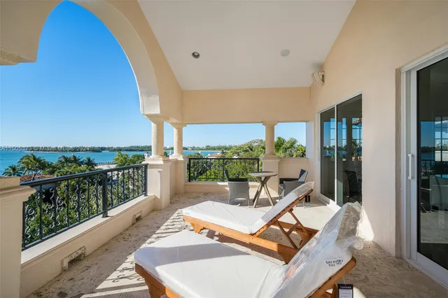 a view of swimming pool with outdoor seating