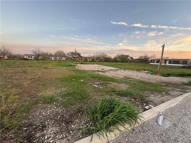 a view of lake with green space