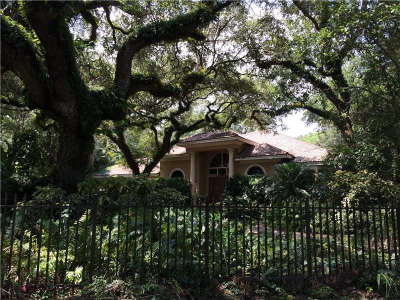 3700 Shady Ridge Road Fort Lauderdale, FL 33312 - Photo 2 of 17 a front view of a house with a yard
