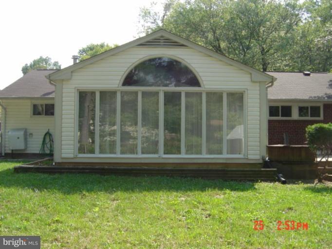 7205 Highland Street Springfield, VA 22150 - Photo 2 of 12 front view of house with a yard