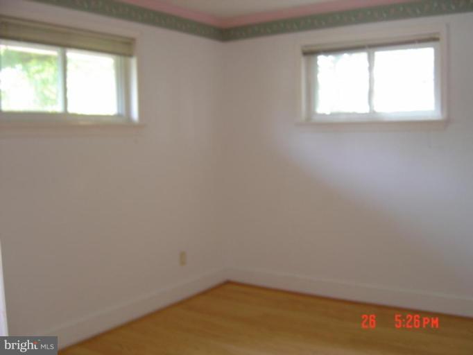 7205 Highland Street Springfield, VA 22150 - Photo 5 of 12 an empty room with a window