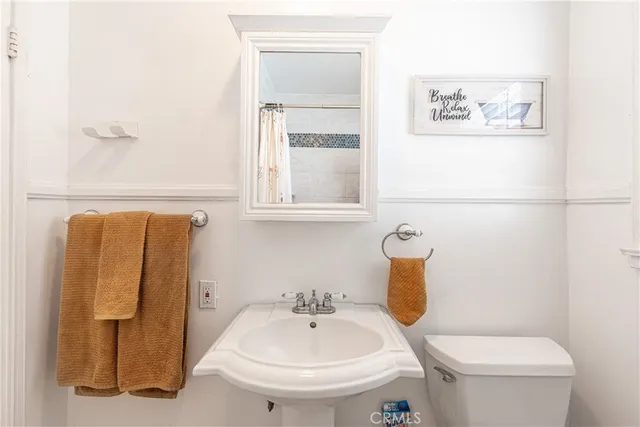 a bathroom with a sink and a toilet