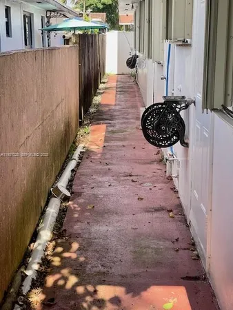a view of a pathway of a house with wooden floor