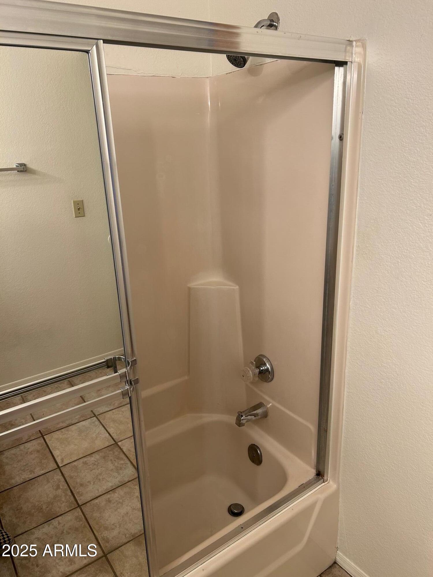 1645 West Baseline Road, Unit 1079 Mesa, AZ 85202 - Photo 14 of 19 a bathroom with a shower and a bath tub