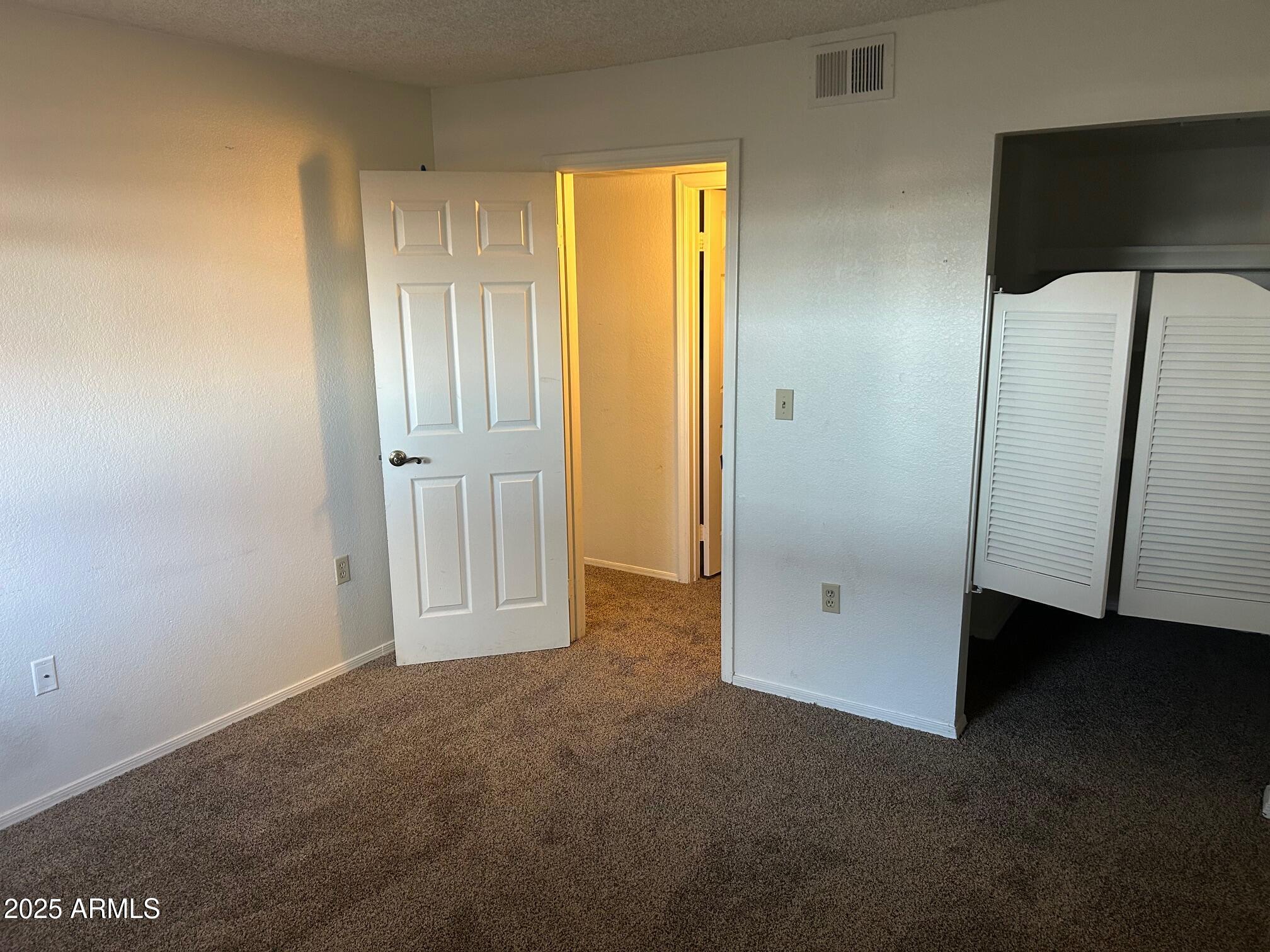 1645 West Baseline Road, Unit 1079 Mesa, AZ 85202 - Photo 15 of 19 a view of an empty room with a window