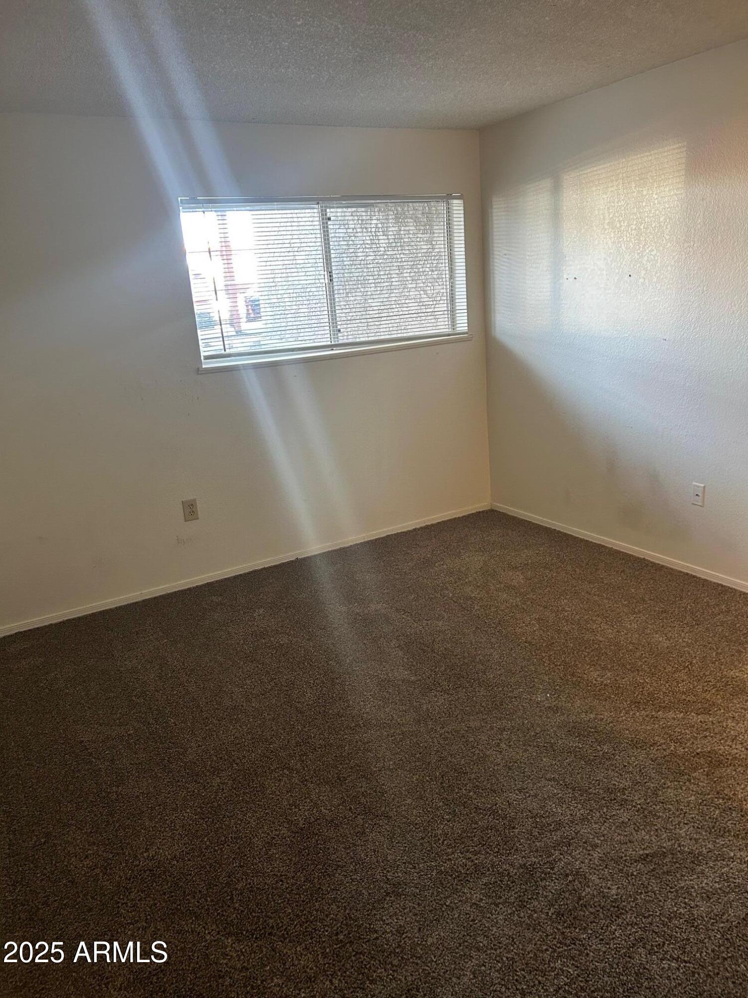 1645 West Baseline Road, Unit 1079 Mesa, AZ 85202 - Photo 17 of 19 an empty room with a window