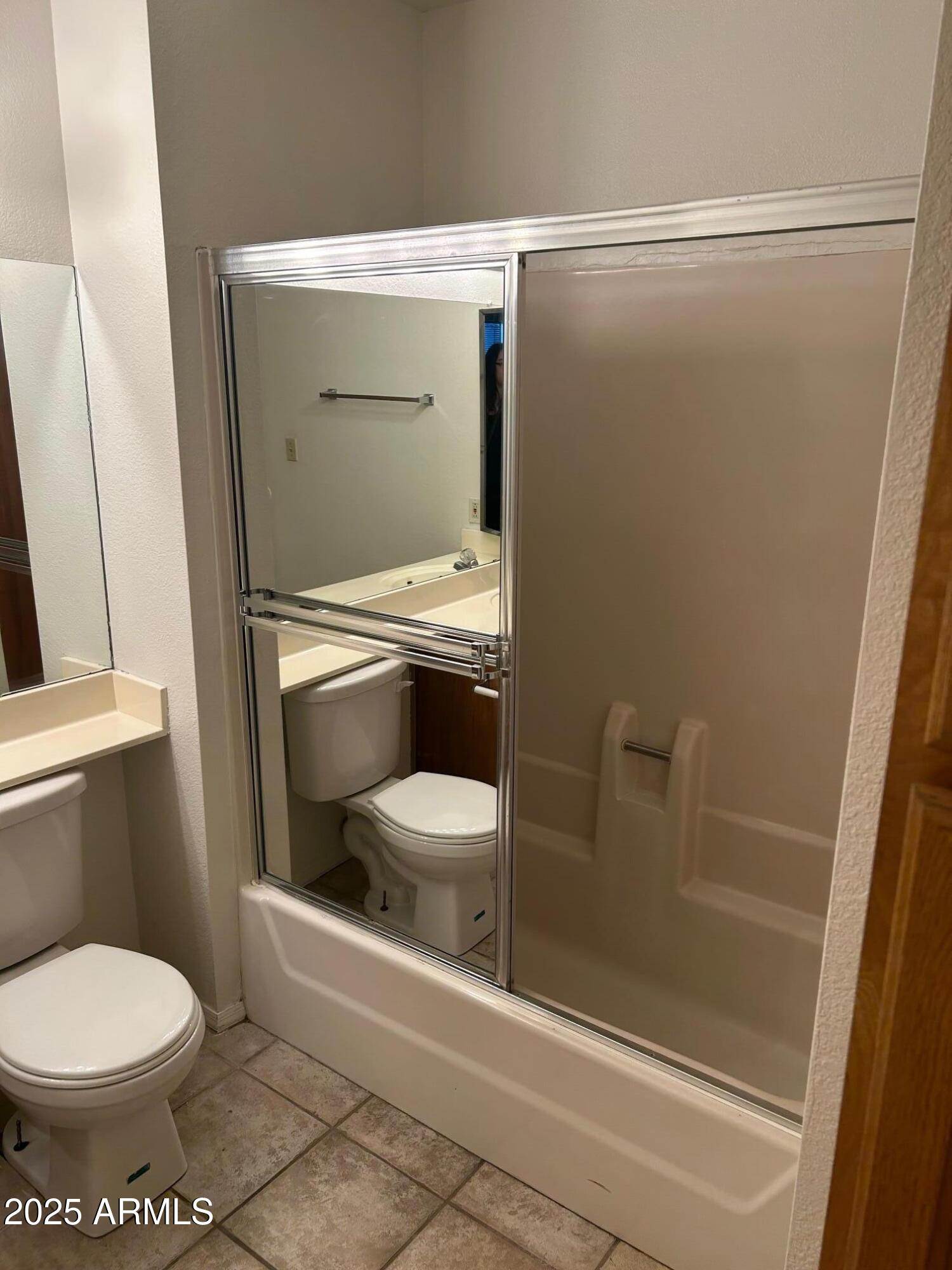 1645 West Baseline Road, Unit 1079 Mesa, AZ 85202 - Photo 19 of 19 a bathroom with a toilet and a shower