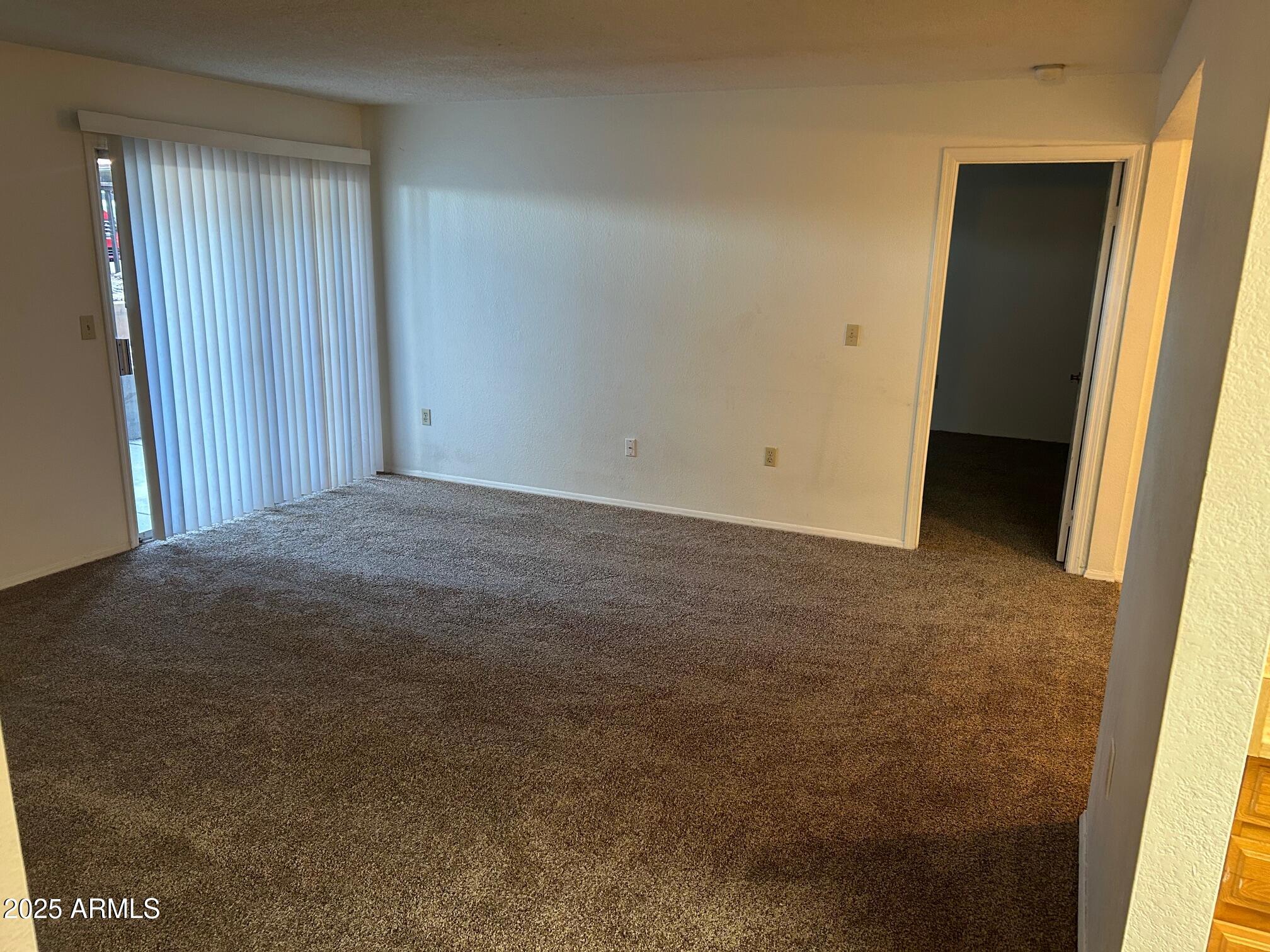 1645 West Baseline Road, Unit 1079 Mesa, AZ 85202 - Photo 7 of 19 an empty room with windows