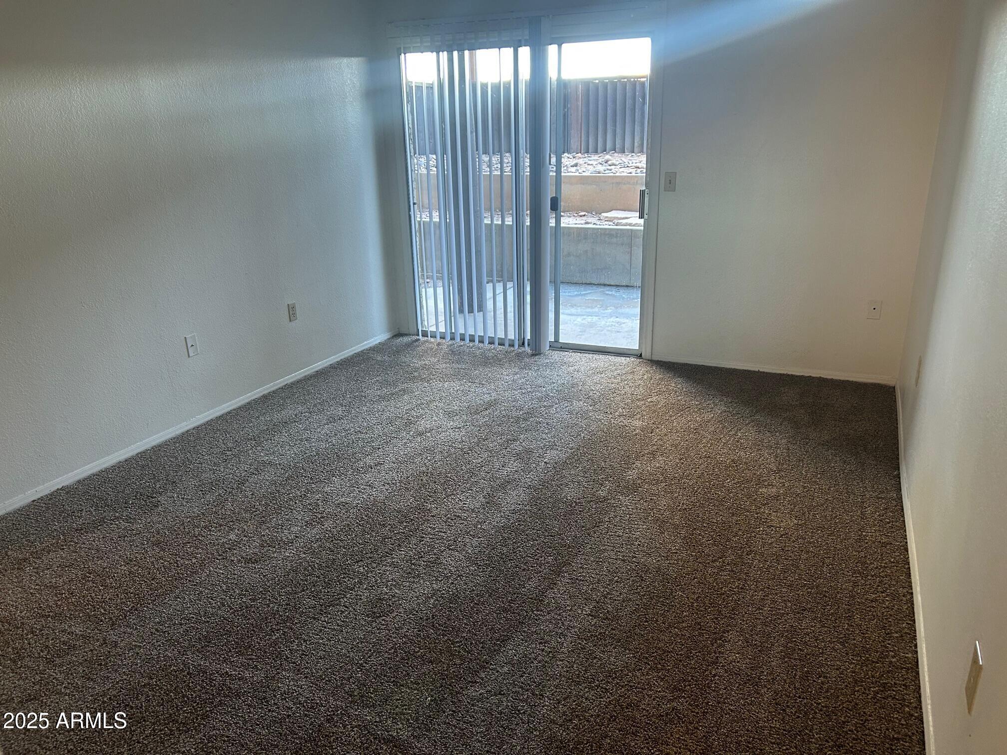 1645 West Baseline Road, Unit 1079 Mesa, AZ 85202 - Photo 9 of 19 a view of an empty room with windows