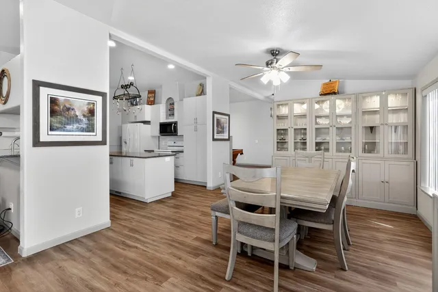 a view of walk in closet with clothes