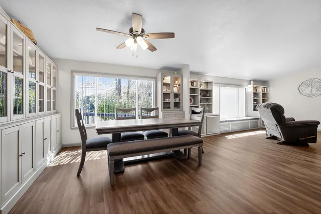 a bathroom with a sink a tub and a mirror