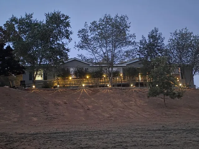 a kitchen with kitchen island granite countertop a sink appliances cabinets and a counter top space