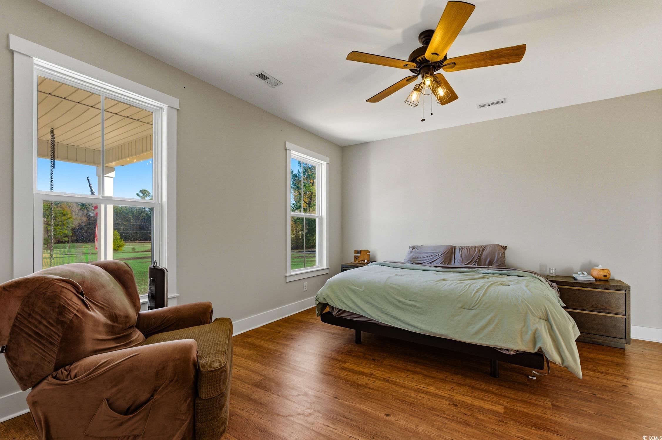 851 Dog Bluff Road Galivants Ferry, SC 29544 - Photo 11 of 25 Bedroom with wood finished floors and ceiling fan