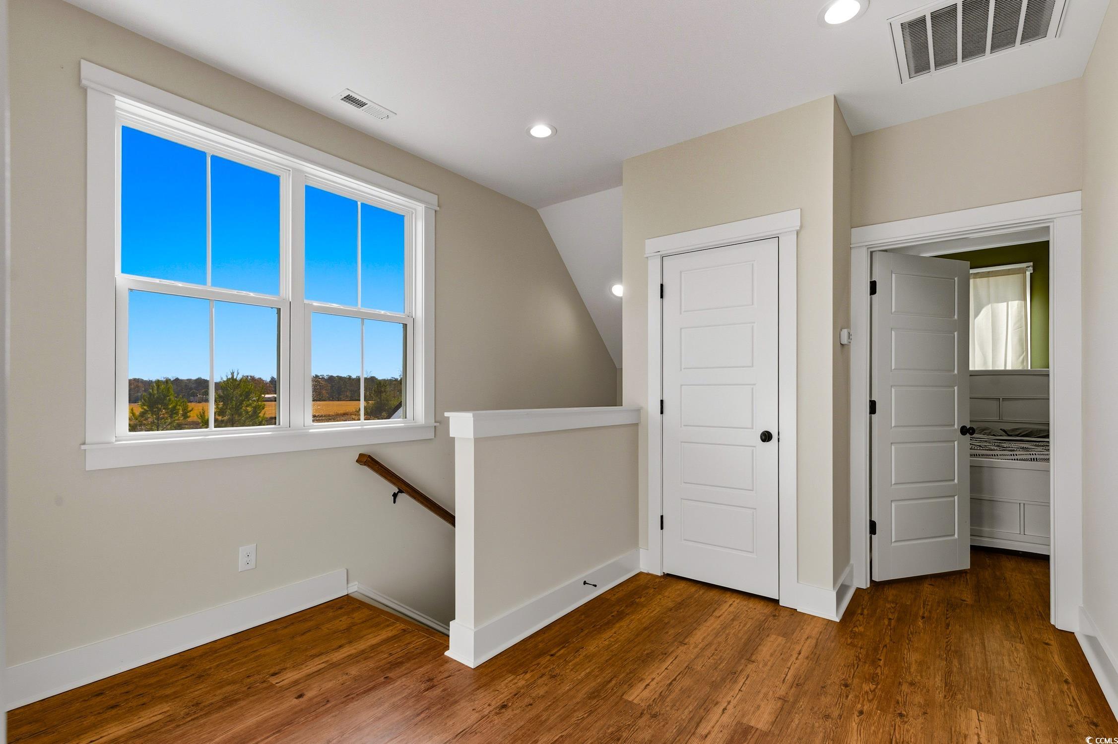 851 Dog Bluff Road Galivants Ferry, SC 29544 - Photo 16 of 25 Hall with an upstairs landing, recessed lighting, dark wood finished floors, and vaulted ceiling