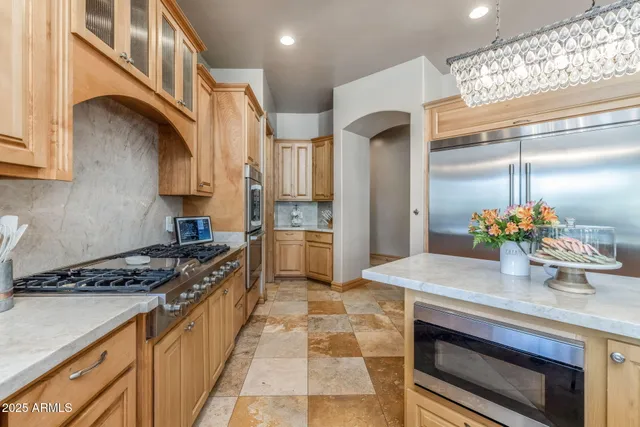 a view of a room with furniture and a window