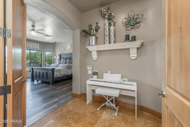 a spacious bathroom with a granite countertop sink a mirror and a shower