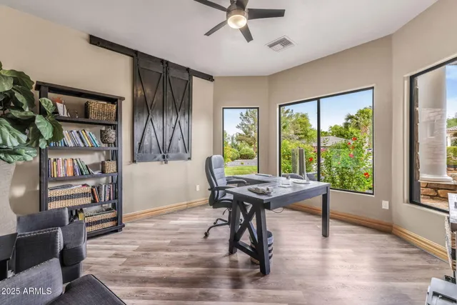 a view of a house with swimming pool and sitting area