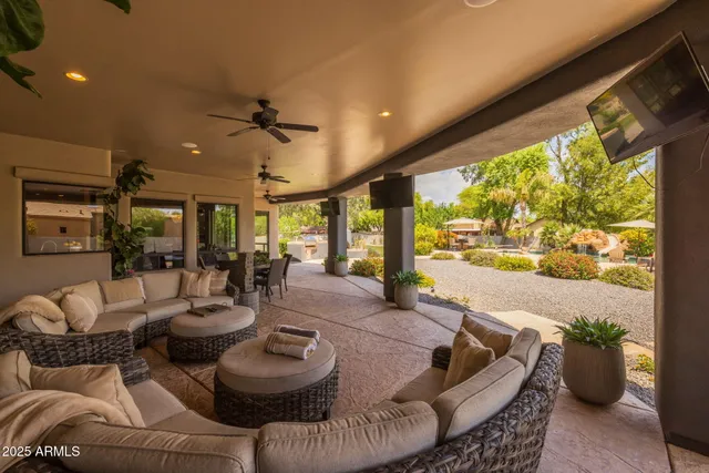 a view of a backyard with sitting area