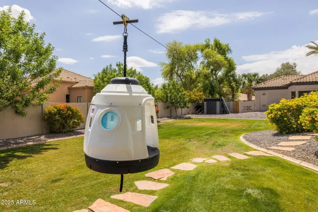 a view of swimming pool with outdoor seating