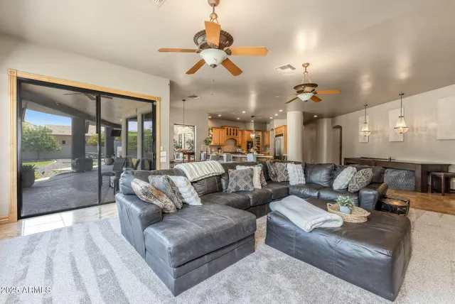 a large kitchen with cabinets table and chairs