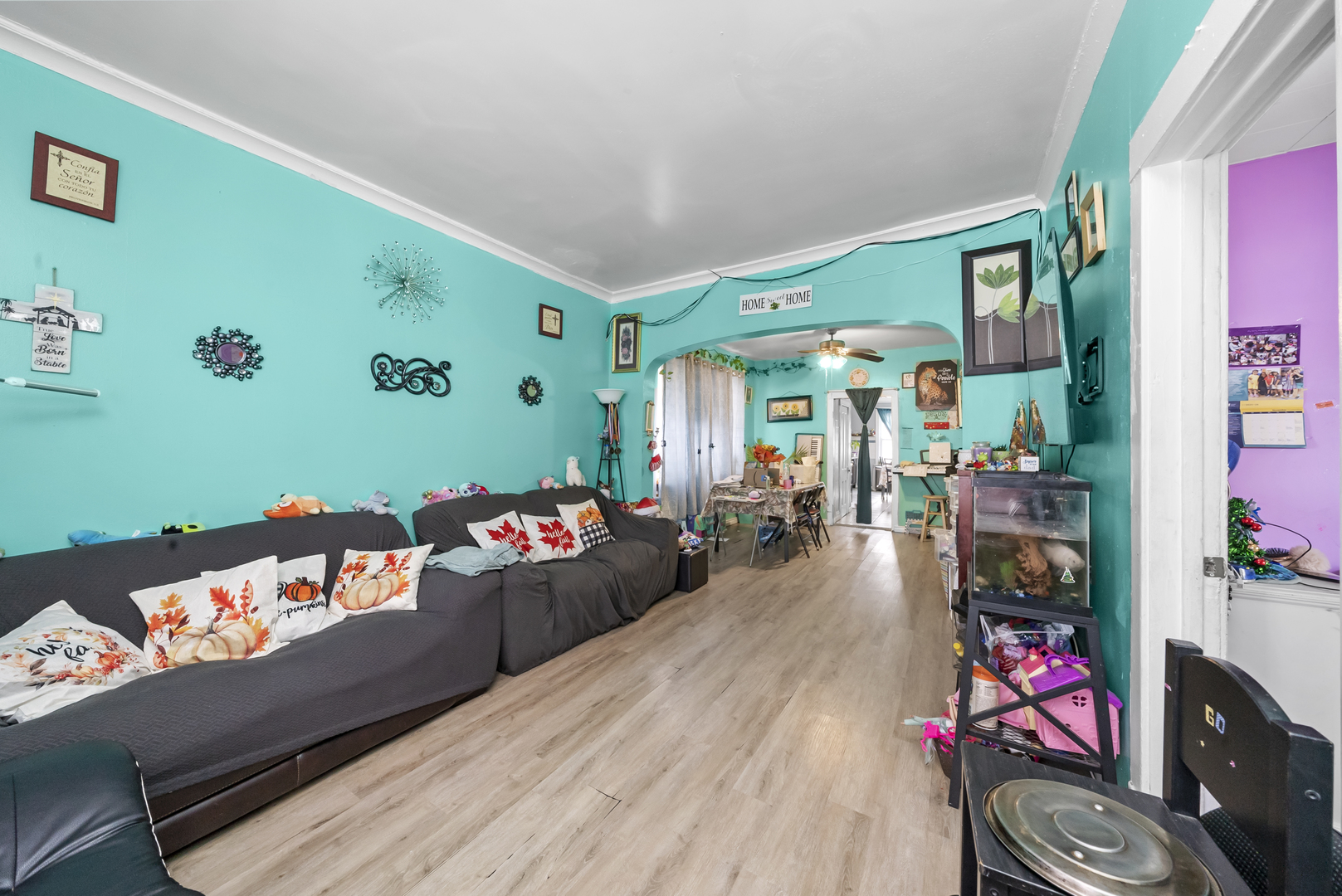 149 East 120th Street Chicago, IL 60628 - Photo 4 of 18 a living room with furniture and a wooden floor