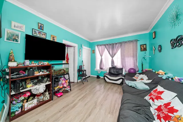 a bedroom with furniture and a flat screen tv