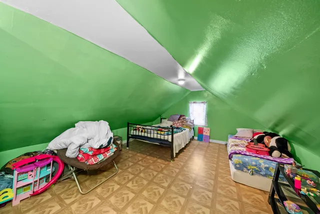 a bed room with a bed and a tv