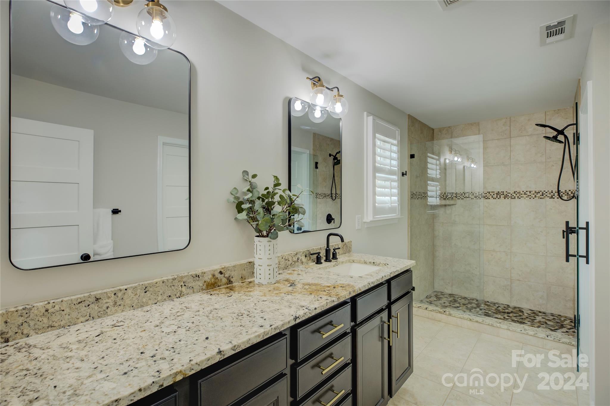 3478 Richard's Crossing Fort Mill, SC 29708 - Photo 16 of 30 a bathroom with a granite countertop sink and a mirror