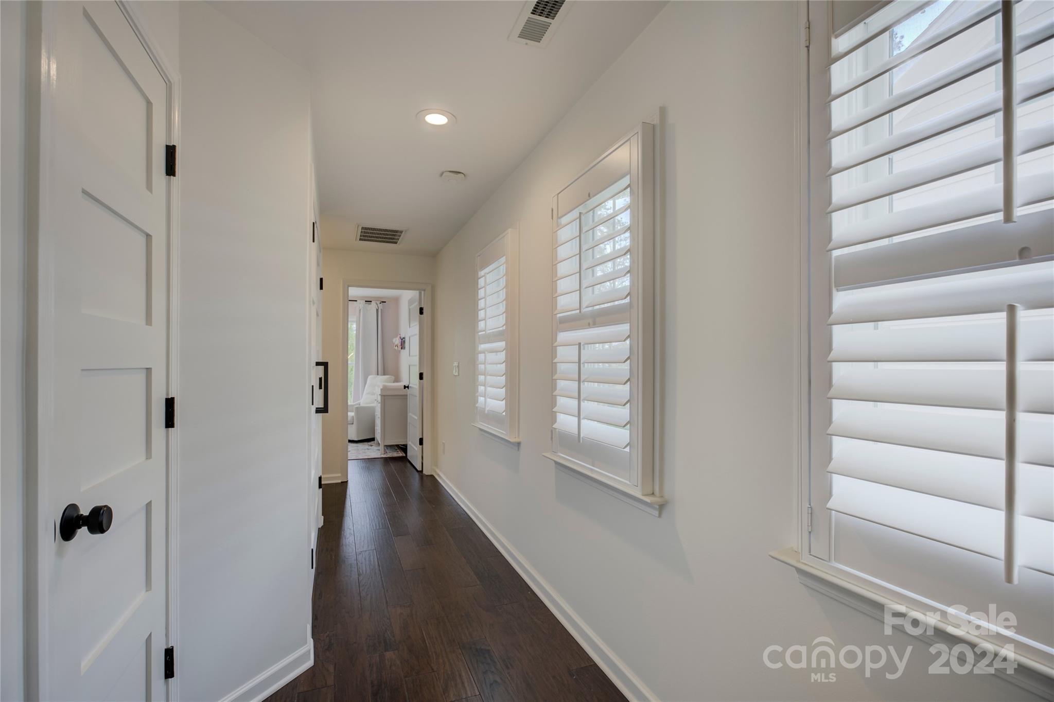 3478 Richard's Crossing Fort Mill, SC 29708 - Photo 17 of 30 a view of a hallway with wooden floor and windows