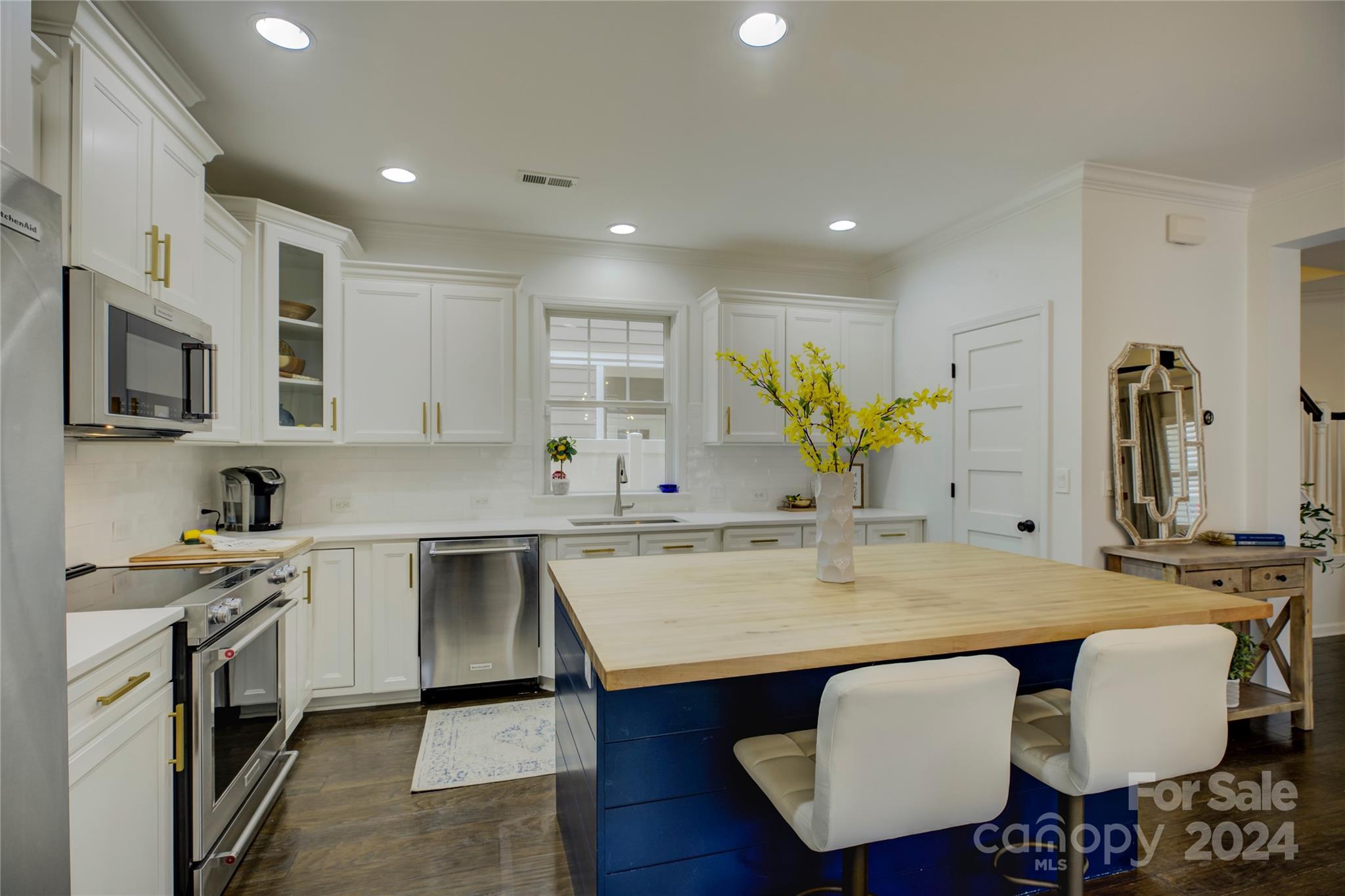 3478 Richard's Crossing Fort Mill, SC 29708 - Photo 7 of 30 a kitchen with a table chairs sink and cabinets