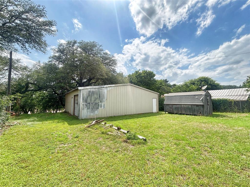 101 Riverview Road Millsap, TX 76066 - Photo 2 of 26 a backyard of a house with lots of green space