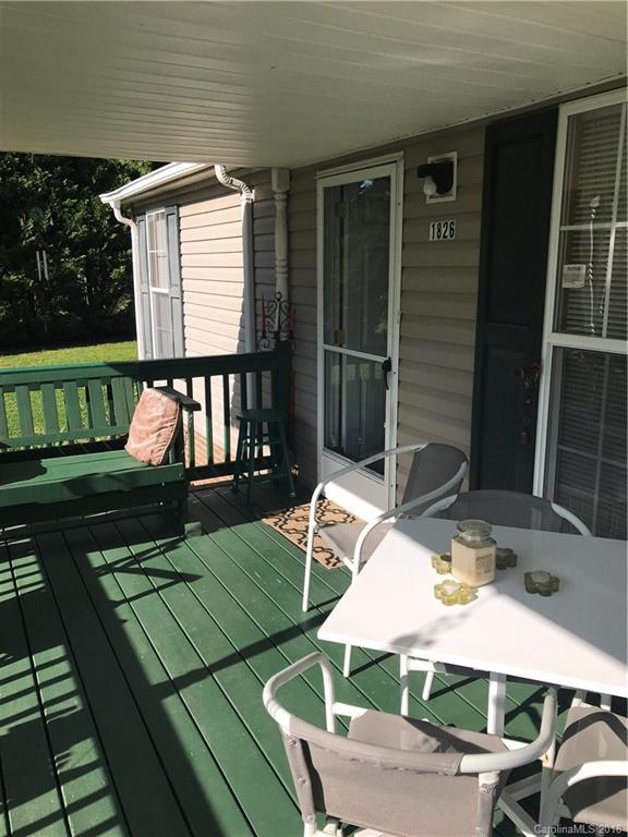 1826 Requa Road Cherryville, NC 28021 - Photo 3 of 24 a view of a chair and table on the wooden deck