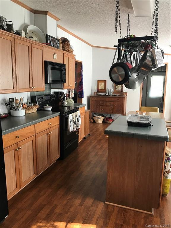 1826 Requa Road Cherryville, NC 28021 - Photo 8 of 24 a kitchen with a sink appliances and cabinets