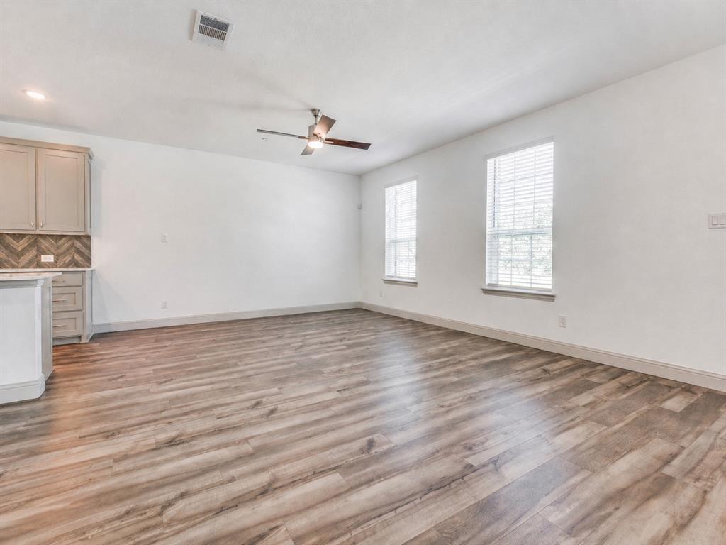 8913 Swallowtail Street Frisco, TX 75035 - Photo 12 of 38 wooden floor in an empty room with a window