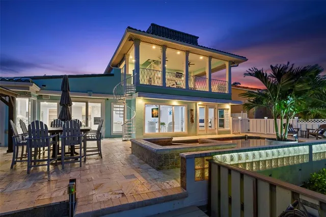 a view of a house with sitting area and furniture
