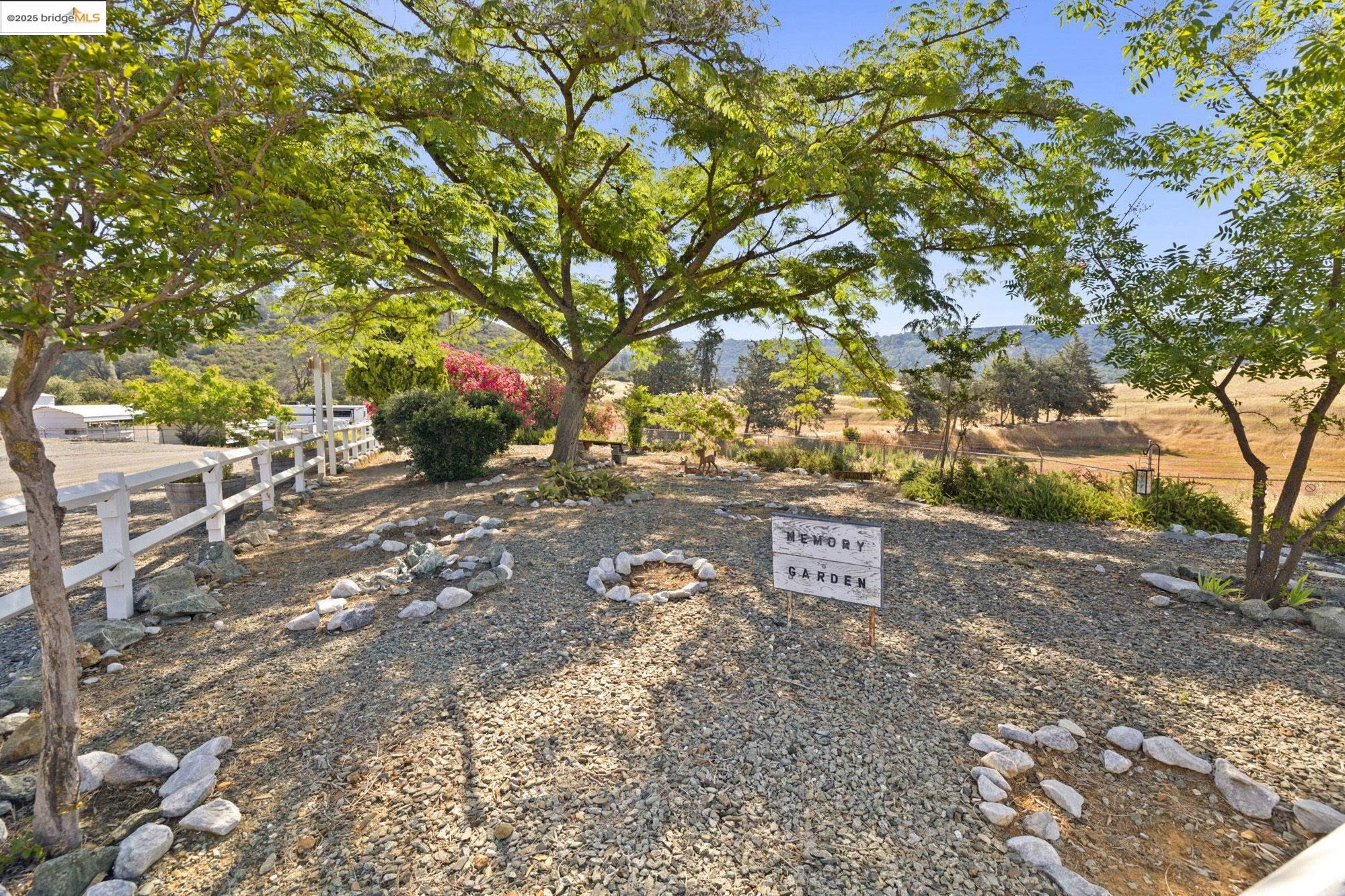 8400 Old Melones Dam Road, Unit 52 Jamestown, CA 95327 - Photo 14 of 21 a view of a street with a tree