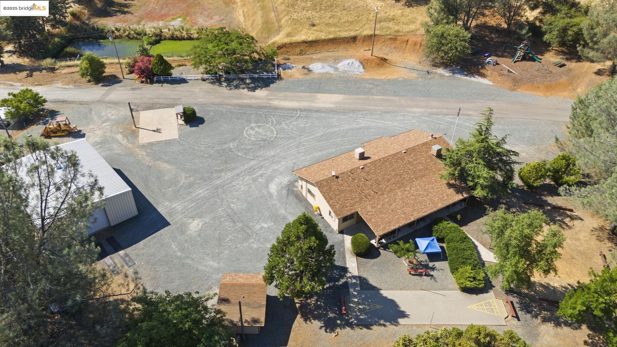 8400 Old Melones Dam Road, Unit 52 Jamestown, CA 95327 - Photo 19 of 21 an aerial view of a house with a yard