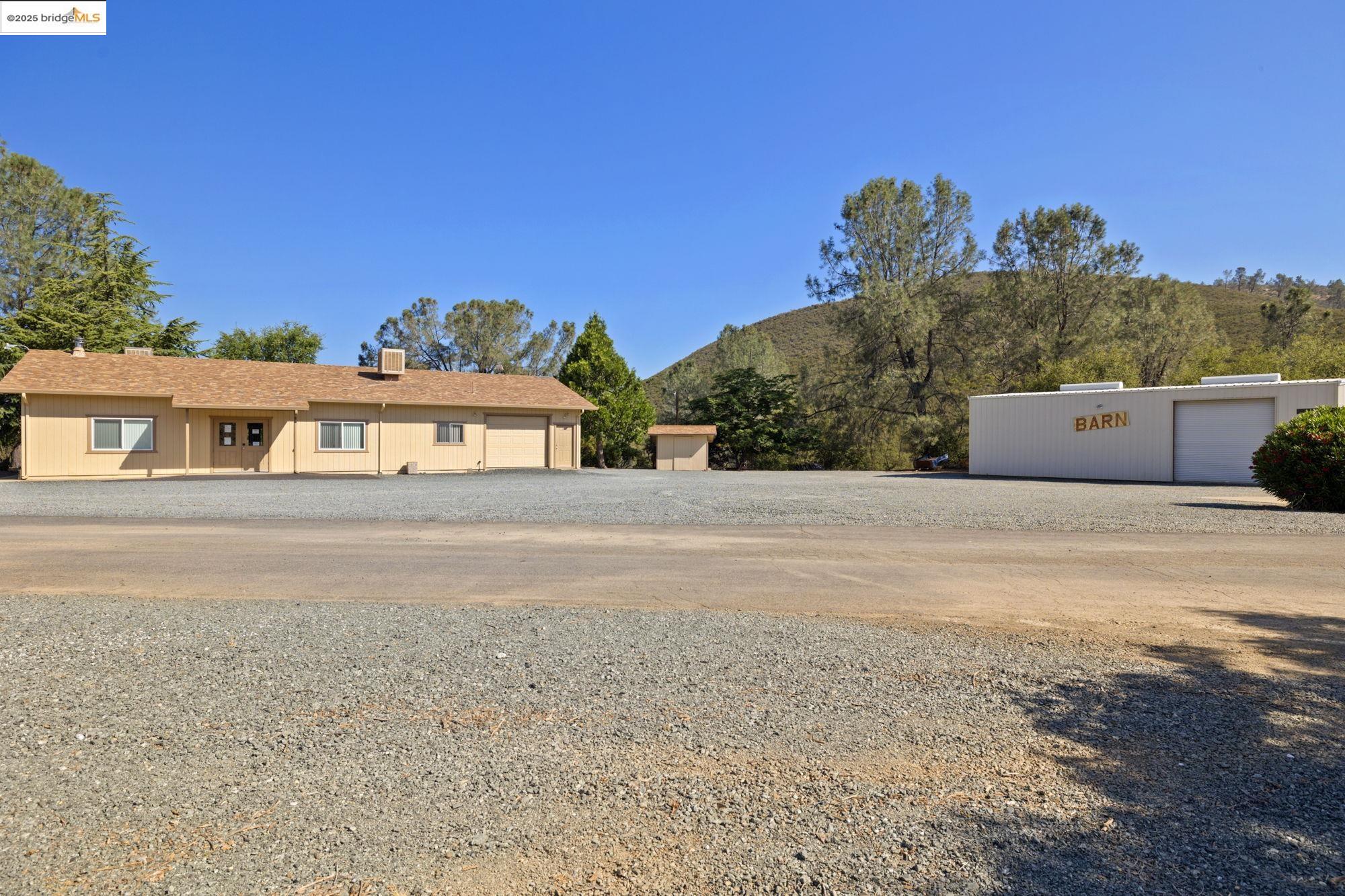 8400 Old Melones Dam Road, Unit 52 Jamestown, CA 95327 - Photo 20 of 21 a front view of a house with a yard