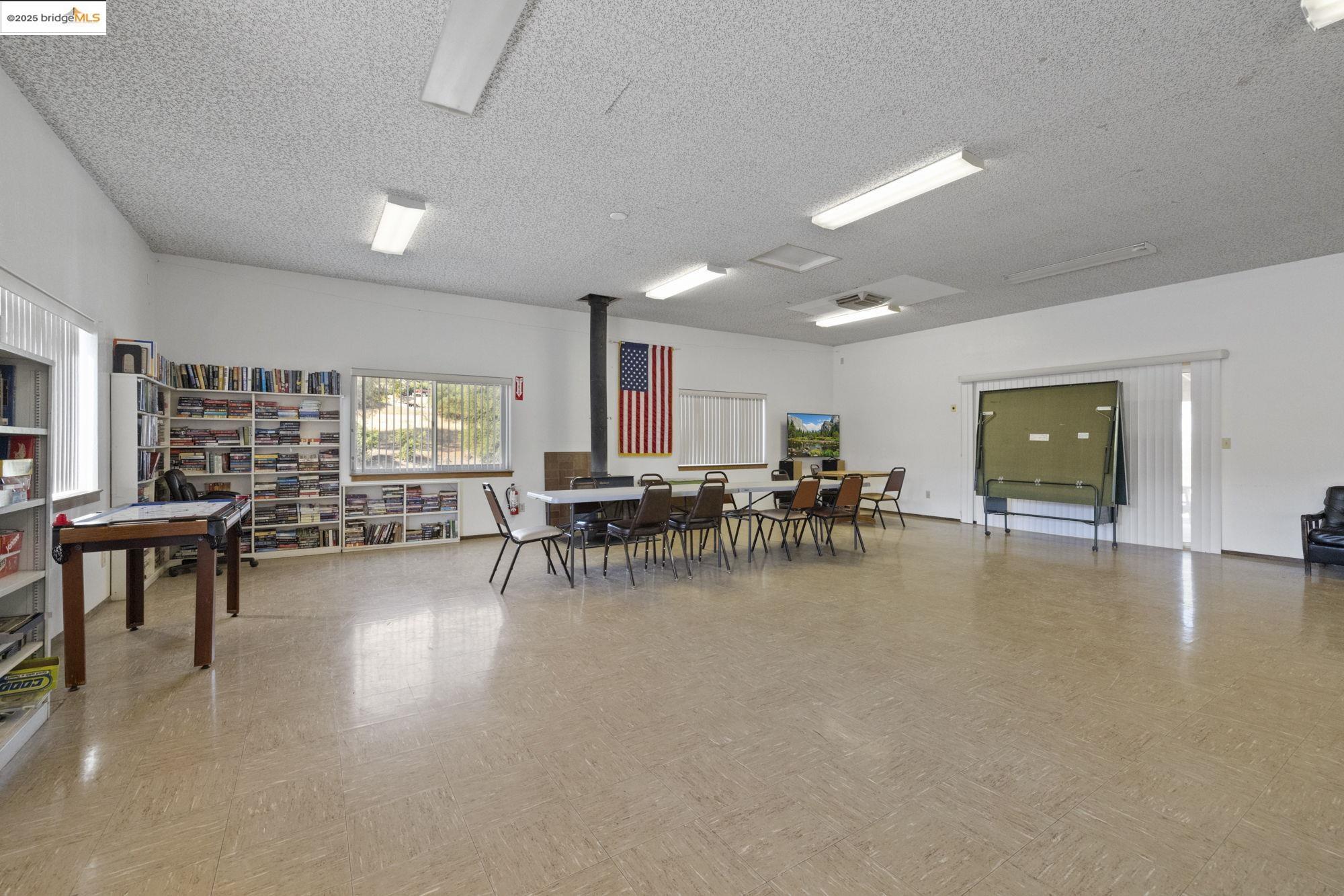 8400 Old Melones Dam Road, Unit 52 Jamestown, CA 95327 - Photo 9 of 21 a view of a big room with dining table and chairs