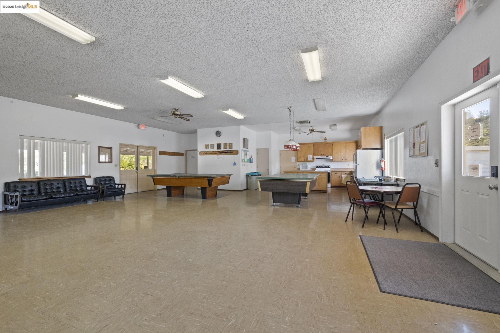 8400 Old Melones Dam Road, Unit 52 Jamestown, CA 95327 - Photo 10 of 21 a living room with furniture and a pool table